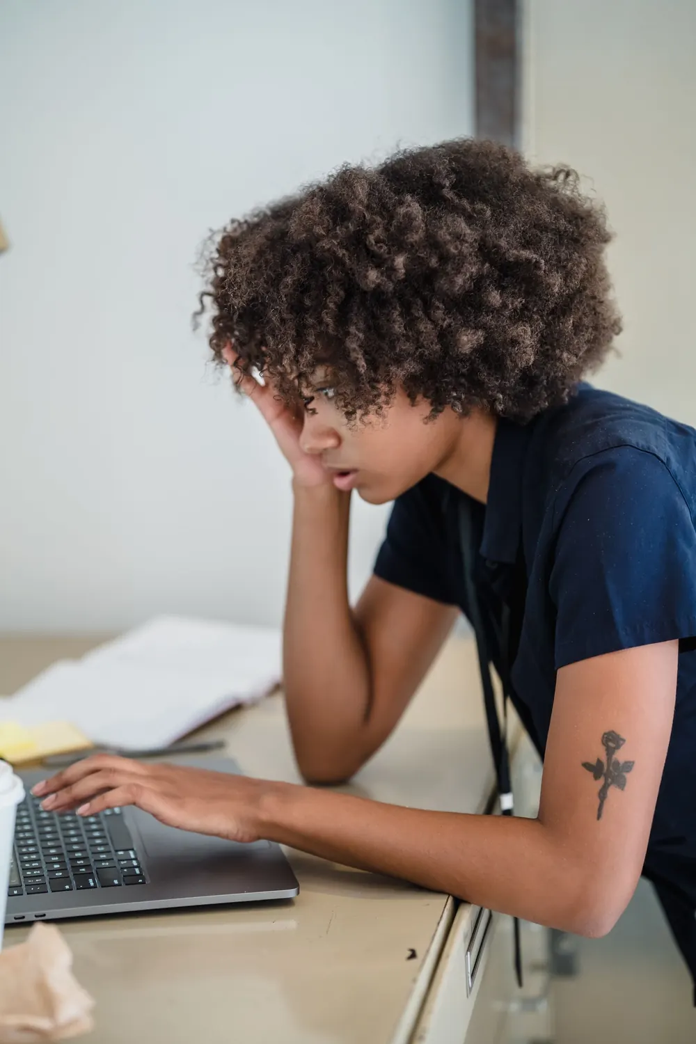 African professional working on a laptop