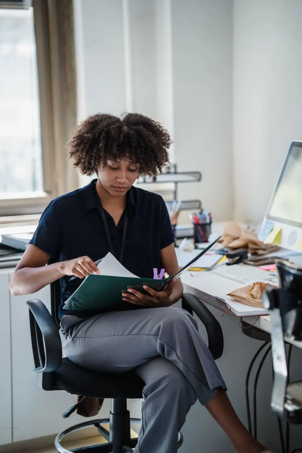 Professional reviewing a report in an office