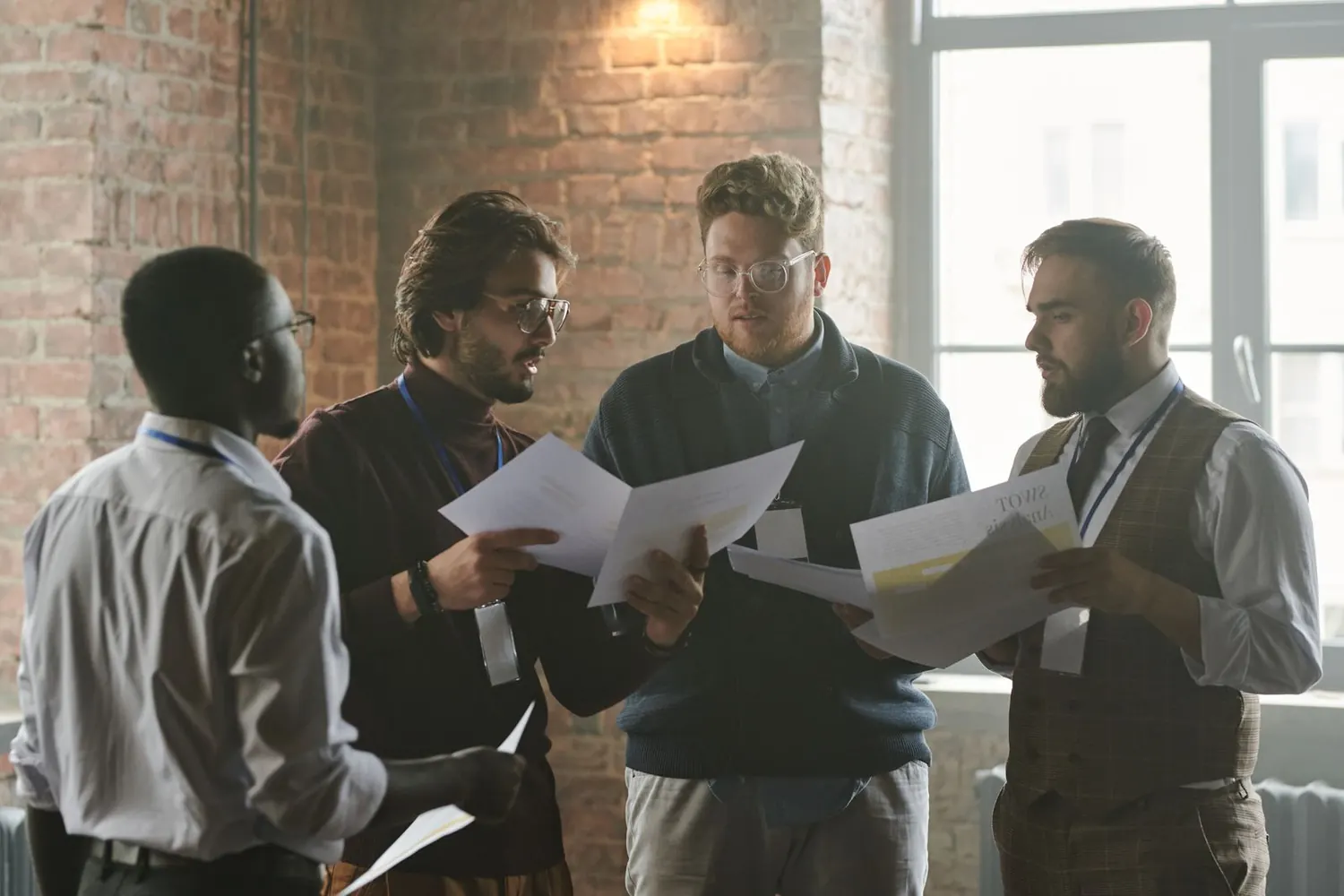 Professionals discussing documents around a table