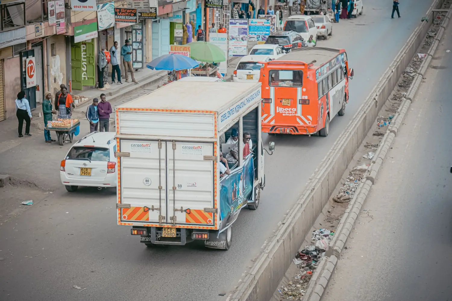 Busy Nairobi city street with vehicles and buildings