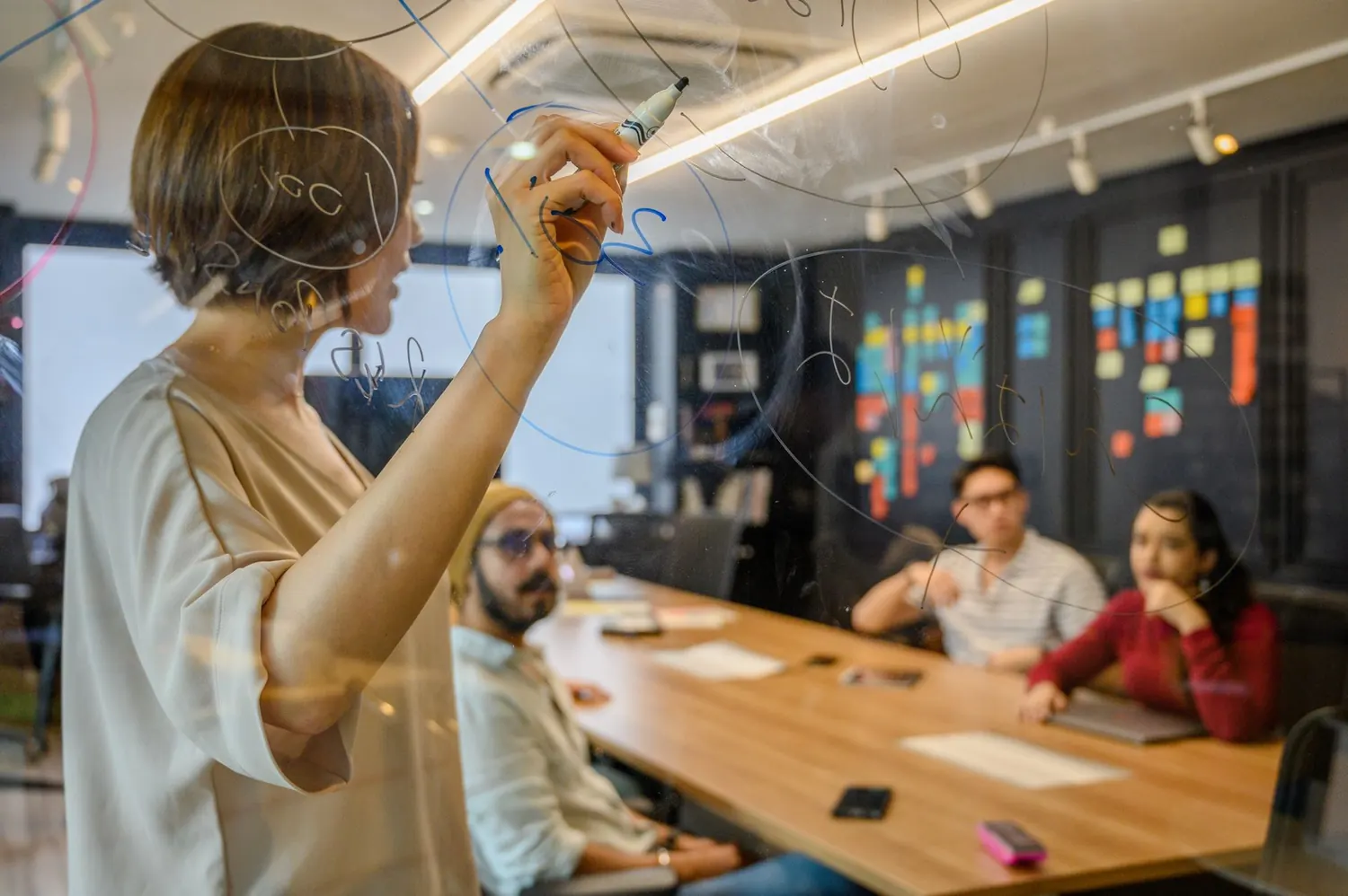 Colleagues discussing a diagram in a planning session